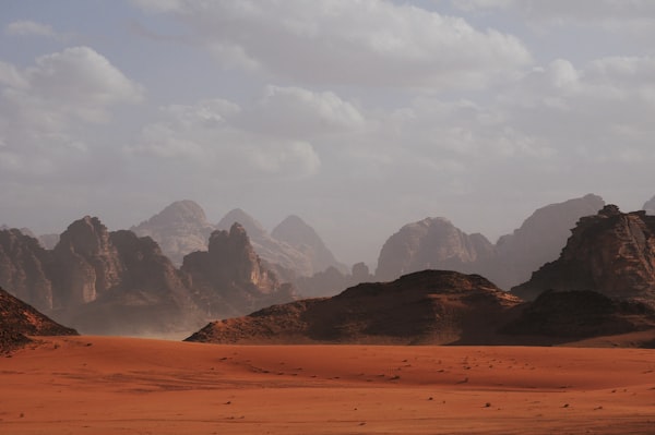 Desert safari vehicles driving over sand dunes in Dubai